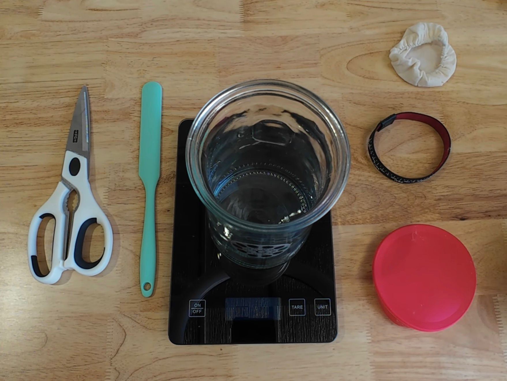 Load video: a videos showing how to feed a sourdough starter