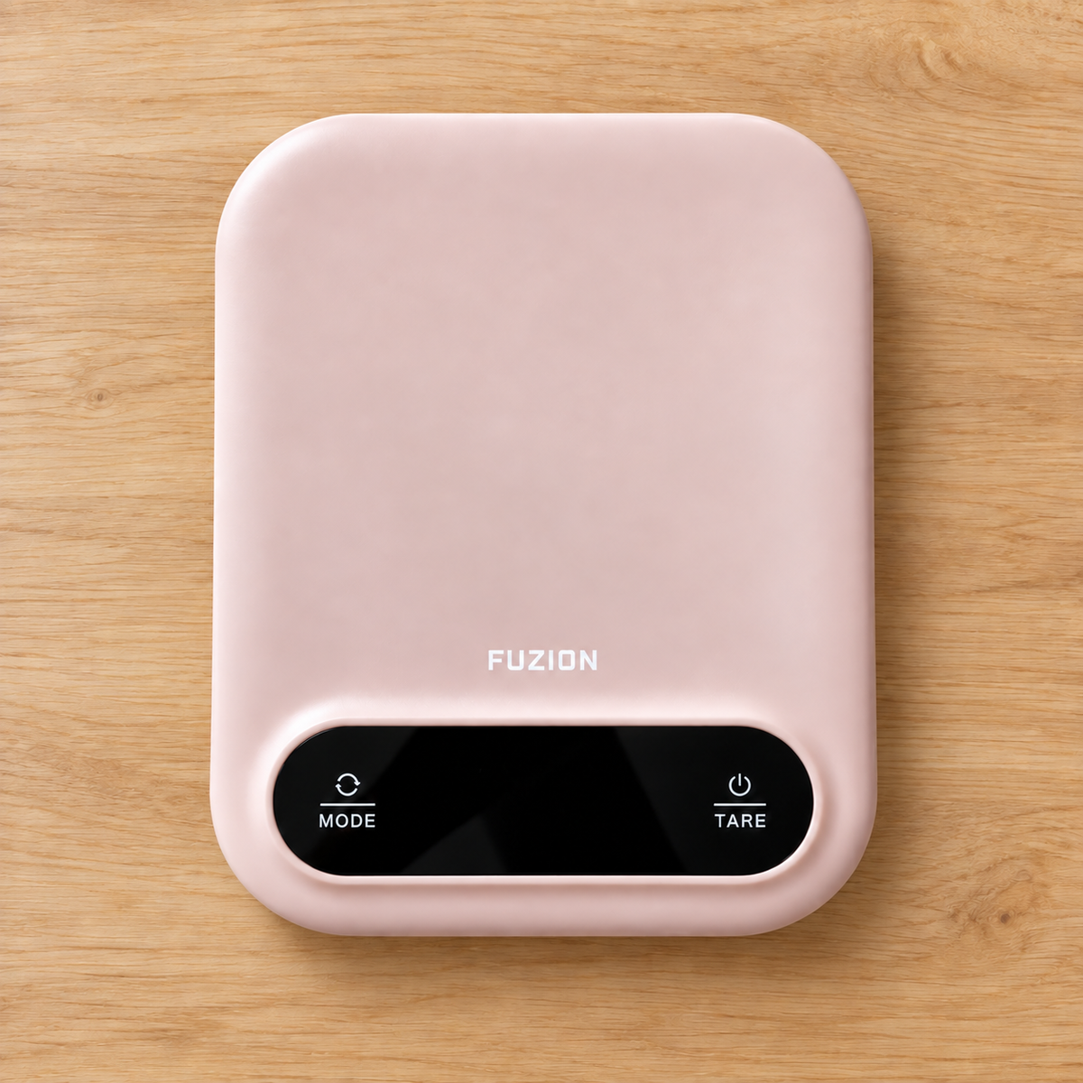 Pink digital kitchen scales on light timber