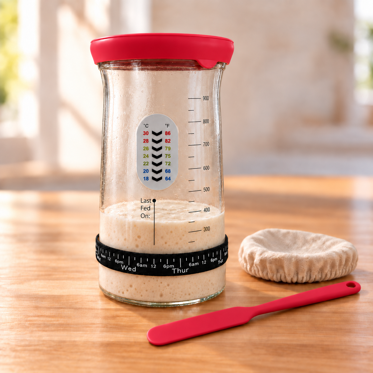 Red sourdough starter care jar with silicone cap, thermometer, feeding band and spatula